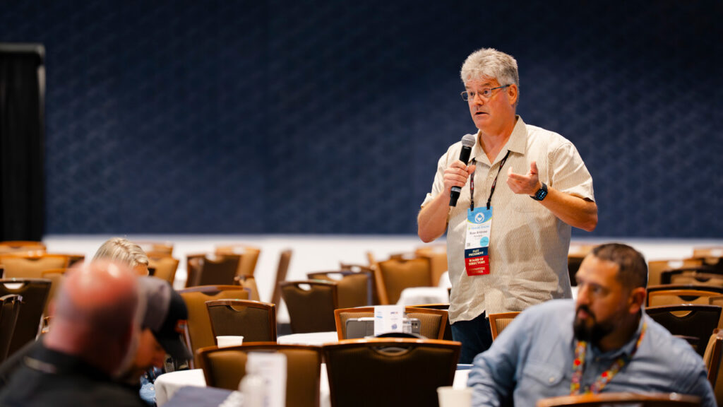 Ross Ambrose speaking at a public meeting